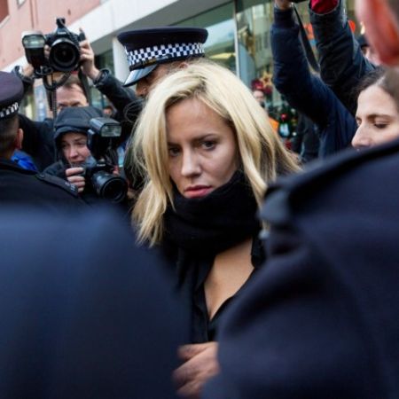 Caroline Flack being harassed by the media as she is escorted by police